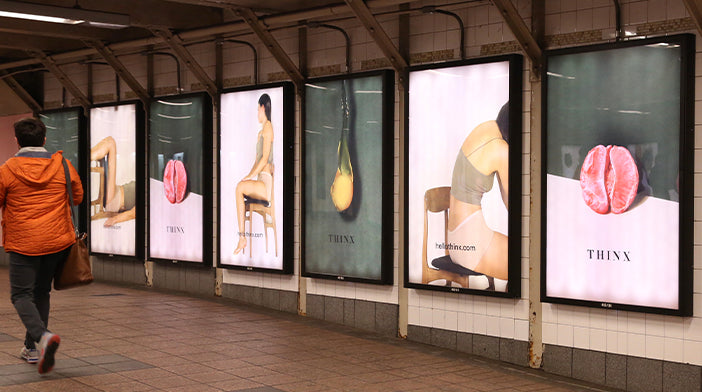 thinx advertisements on a subway wall