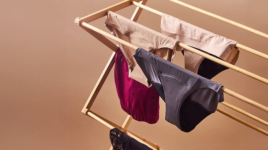 period underwear hanging on laundry rack