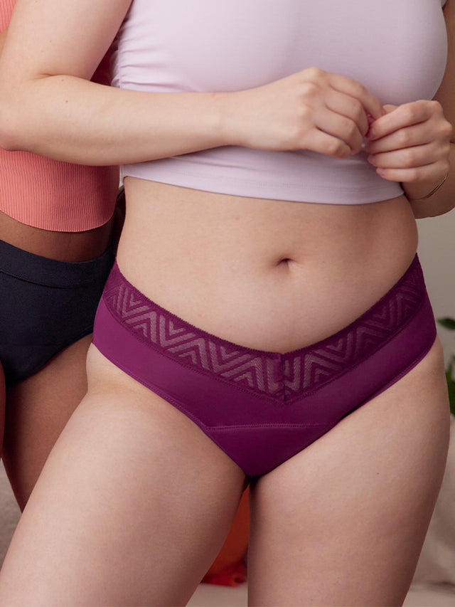 model wearing period underwear in plum