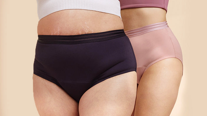 two models wearing absorbent underwear in black and pink