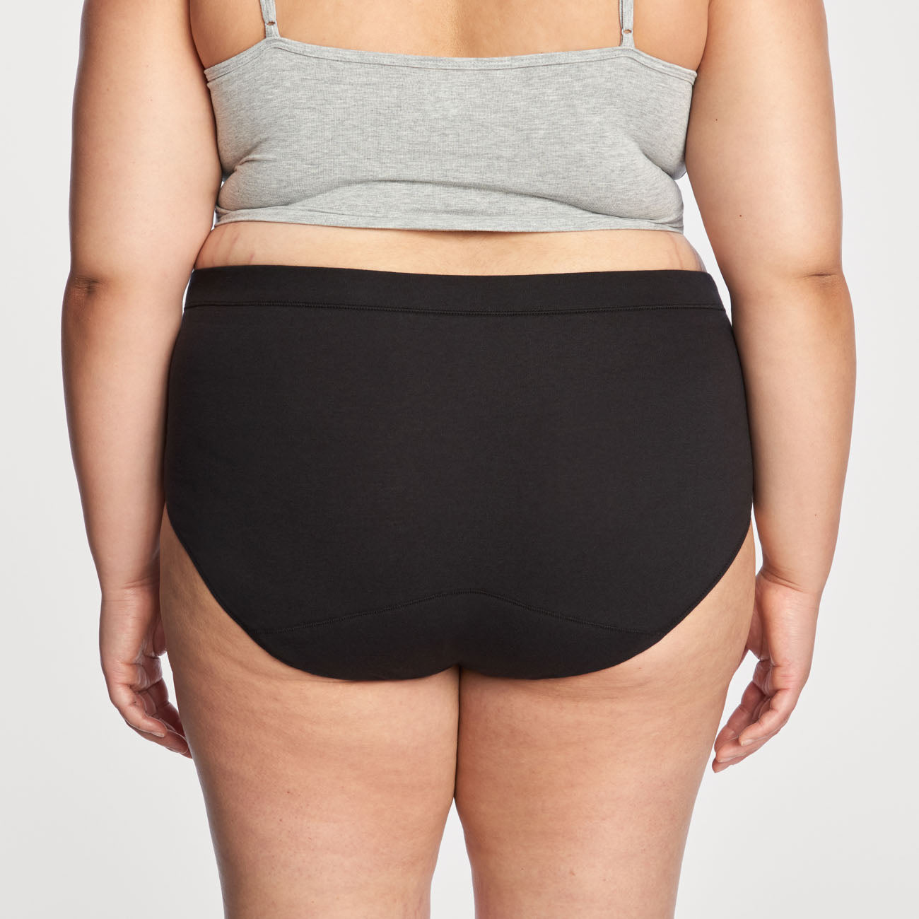 back view of thinx everyday comfort hiwaist in black